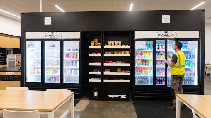 Glass-door coolers stocked with sports drinks, sodas, water and energy drinks.